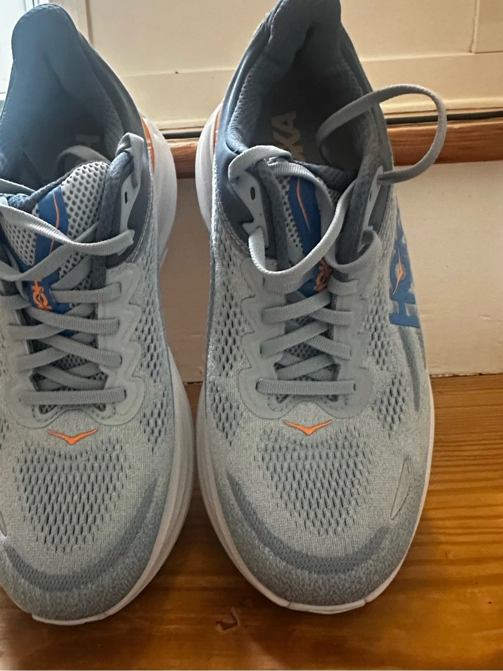Hoka Men's Light Gray and Blue Running Shoes with Orange Accents